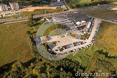 Drone photography of logistical warehouse, car parks and highway road Stock Photo
