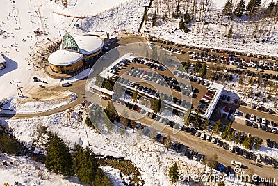 Drone photography of ski resort, parking place, mountains and forest Stock Photo