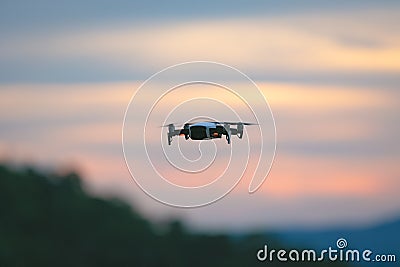 Drone pilotage on the sky at sunset Stock Photo