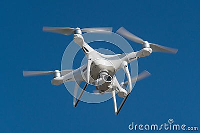 Drone quad copter with high resolution digital camera on the sky Stock Photo