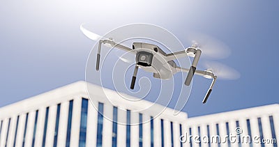 Drone quadcopter flies over office buildings Stock Photo