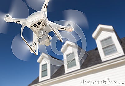 Drone Quadcopter Flying, Inspecting and Photographing House Stock Photo