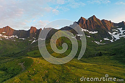 Drone shot above mountain peaks during sunset in Northern Norway Stock Photo
