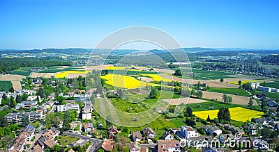 Drone shot of spring Swiss countryside townscape, panorama, blue sky background Stock Photo