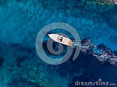 Drone shot of Zakynthos island with beautiful turquoise Ionian sea and ship near famous Navagio beach during daytime Stock Photo