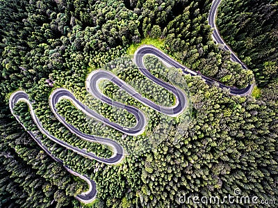 Drone view of a curvy road in Romania Stock Photo