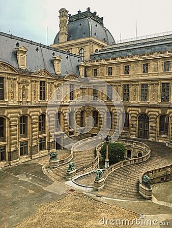 Drone view of the horseshoe shaped staircase in the outdoor courtyard in Louvre Palace, Paris Editorial Stock Photo
