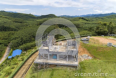 Drone view of steel roof construction,construction workers to roofing metal frame Editorial Stock Photo