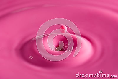 Drop of pink milk Stock Photo