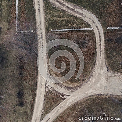 Drone shot of gravel road at the farm Stock Photo