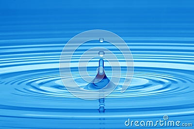 Drop of water in blue Stock Photo