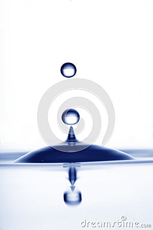 Drop of water in dark blue Stock Photo