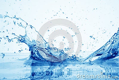 Drop of water in puddle in blue Stock Photo