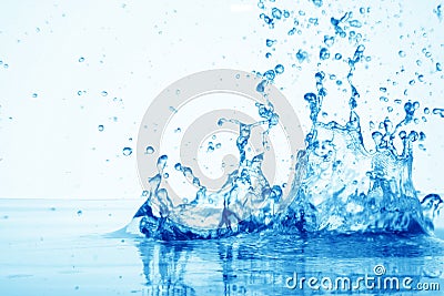 Drop of water in puddle in blue Stock Photo