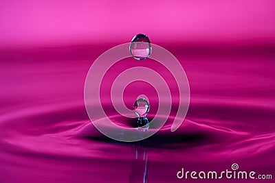 Drop of water splashing macro with ripples Stock Photo