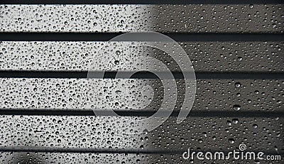 Droplets between the blinds Stock Photo