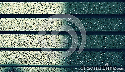 Droplets between the blinds Stock Photo