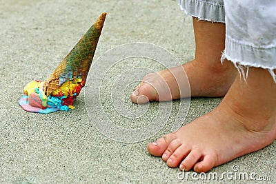 Dropped Ice Cream Cone by Feet Stock Photo