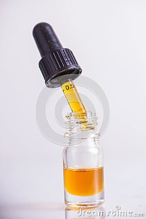 Dropper with CBD oil, cannabis live resin extraction isolated Stock Photo