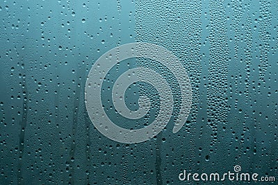 Drops on the glass, adstract blue background Stock Photo