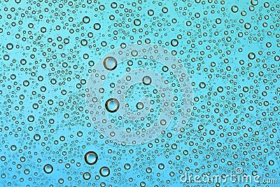 Drops on glass of different sizes and colors on a colored background, texture Stock Photo