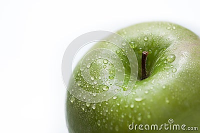 Drops on a green apple Stock Photo