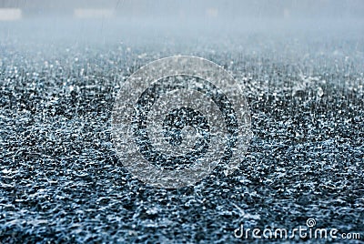 Drops of heavy rain on asphalt road Stock Photo