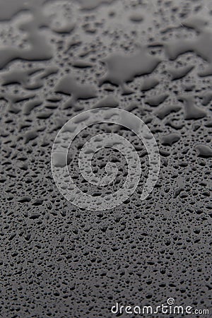 Drops of water on black texture. Walpaper Stock Photo