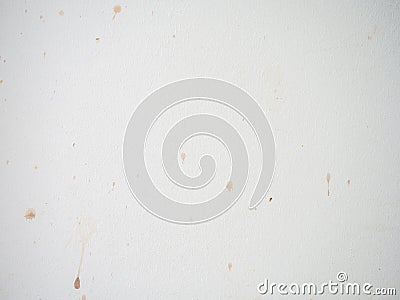 Drops on a white surface. Splashes of wine on the white wall. Dirty surface. To be cleaned Stock Photo