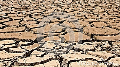 Drought concept image consisting of a dry cracked river bed Stock Photo