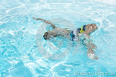 Drowning in the swimming pool Desperate, drown. Stock Photo
