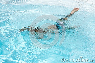 Drowning in the swimming pool Desperate, drown. Stock Photo