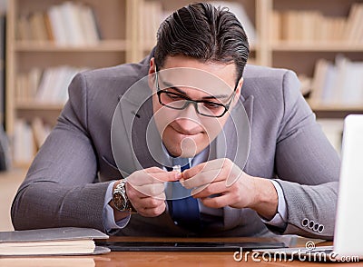 Drug addict businessman in the office Stock Photo