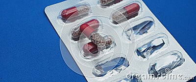 The drug in capsules. Capsules lie in plastic transparent packaging Stock Photo