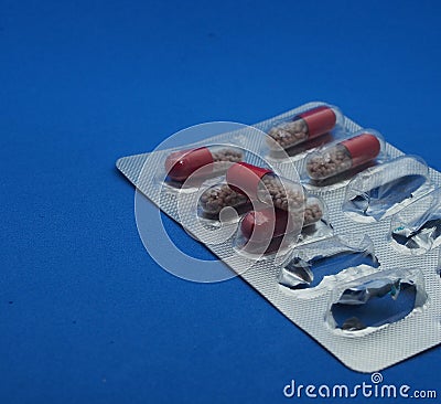 The drug in capsules. Capsules lie in plastic transparent packaging Stock Photo