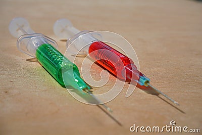 Drug injected by injection, good or bad. Choice for health and against flu virus. Stock Photo