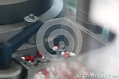 Drugs in Pharmaceutical machine close up Stock Photo