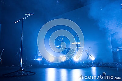 Drum kit and microphone on an empty stage Stock Photo
