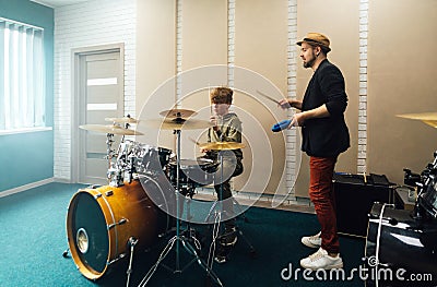 Drum lesson with a teacher. Music school. Stock Photo