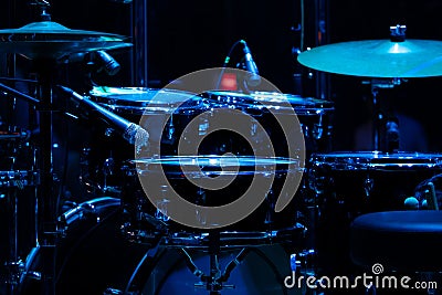 drum set on stage in a concert hall. Large-sized photo with soft change selectivity. Vintage live music background Stock Photo