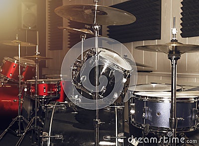 Drumkit in red and silver colors with drums and cymbals Stock Photo