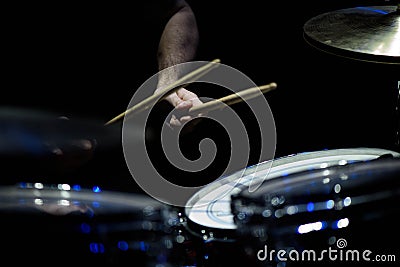 The drummer in action. A photo close up process play on a musical instrument. Stock Photo