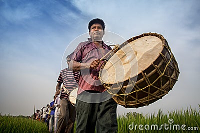 A Drummer Playing Drum in Gajan Festival. Editorial Stock Photo