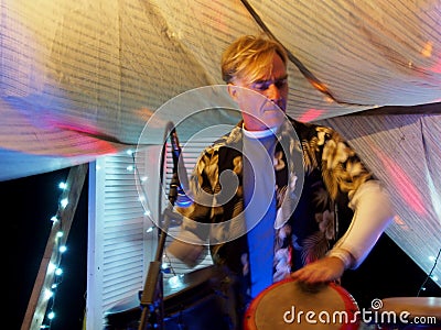 Drummer playing drums on stage Editorial Stock Photo