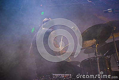 Drummer playing on stage at live concert Editorial Stock Photo