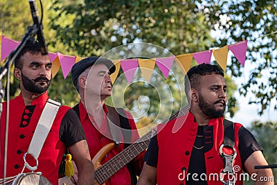 Drummers from the Dhol Foundation playing at an annual concert of Jewish Klezmer music in Regent`s Park in London UK. Editorial Stock Photo