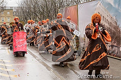 Drummers group marching under rain at Carnival parade, Stuttgart Editorial Stock Photo