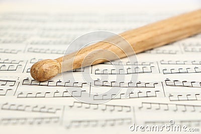 Drumstick and Music Sheet Stock Photo