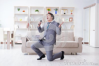 The drunk businessman celebrating in the office Stock Photo