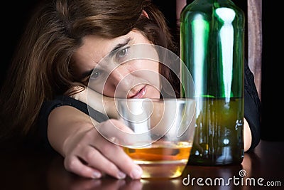 Drunk and depressed lonely woman Stock Photo